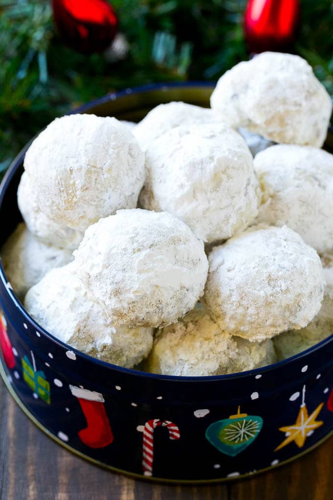 Snowball Cookies Recipe | Mexican Wedding Cookies | Russian Tea Cakes #cookies #pecan #chocolate #baking #dessert #christmas #sraye Snowball cookies coated in powdered sugar and served in a holiday tin,