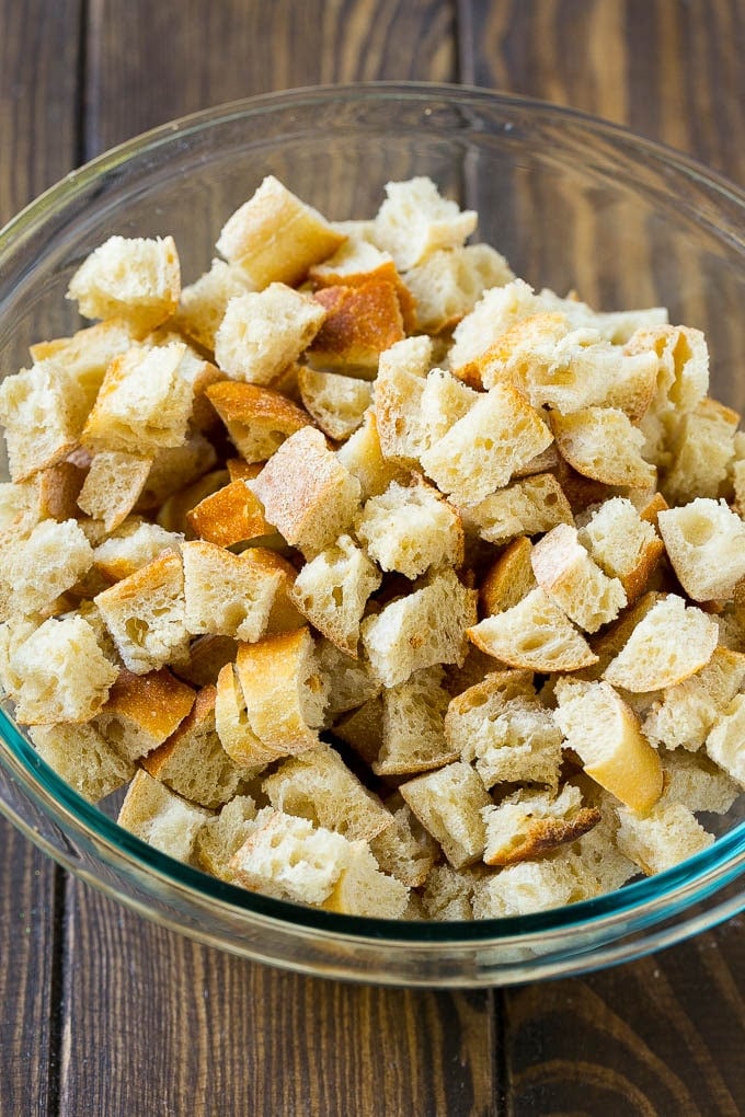 Turkey Stuffing Recipe | Thanksgiving Stuffing | Classic Stuffing #thanksgiving #stuffing #sidedish #fall #sraye Dried bread cubes in a mixing bowl.