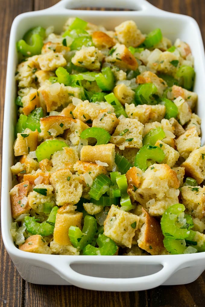 Turkey Stuffing Recipe | Thanksgiving Stuffing | Classic Stuffing #thanksgiving #stuffing #sidedish #fall #sraye Uncooked holiday stuffing in a baking dish.