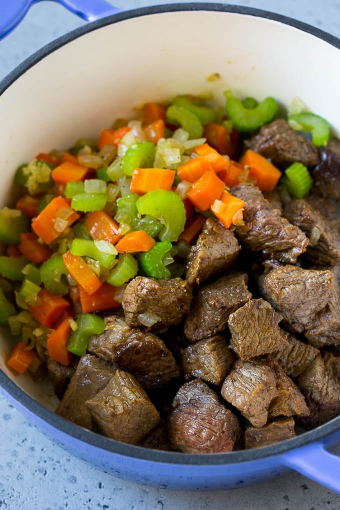 Vegetable Beef Soup Recipe | Beef Vegetable Soup | Beef Soup #beef #veggies #soup #dinner #glutenfree #sraye Beef stew meat, carrots, onion and celery in a pot.