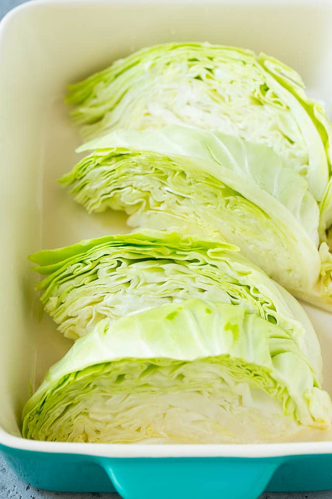 Braised Cabbage Recipe | Easy Cabbage Recipe #cabbage #lowcarb #keto #carrots #veggies #vegetarian #dinner #sraye Wedges of cabbage in a baking dish.
