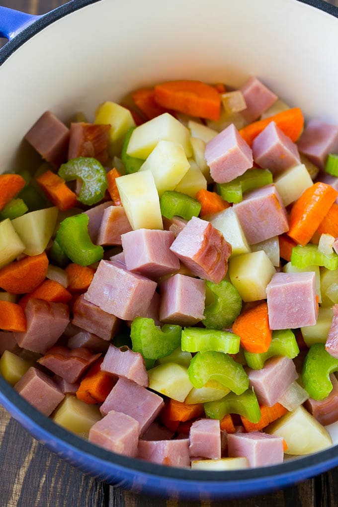 Ham and Potato Soup | Ham Soup | Potato Soup #soup #ham #potato #dinner #comfortfood #sraye Diced ham, carrots, potatoes and celery in a soup pot.