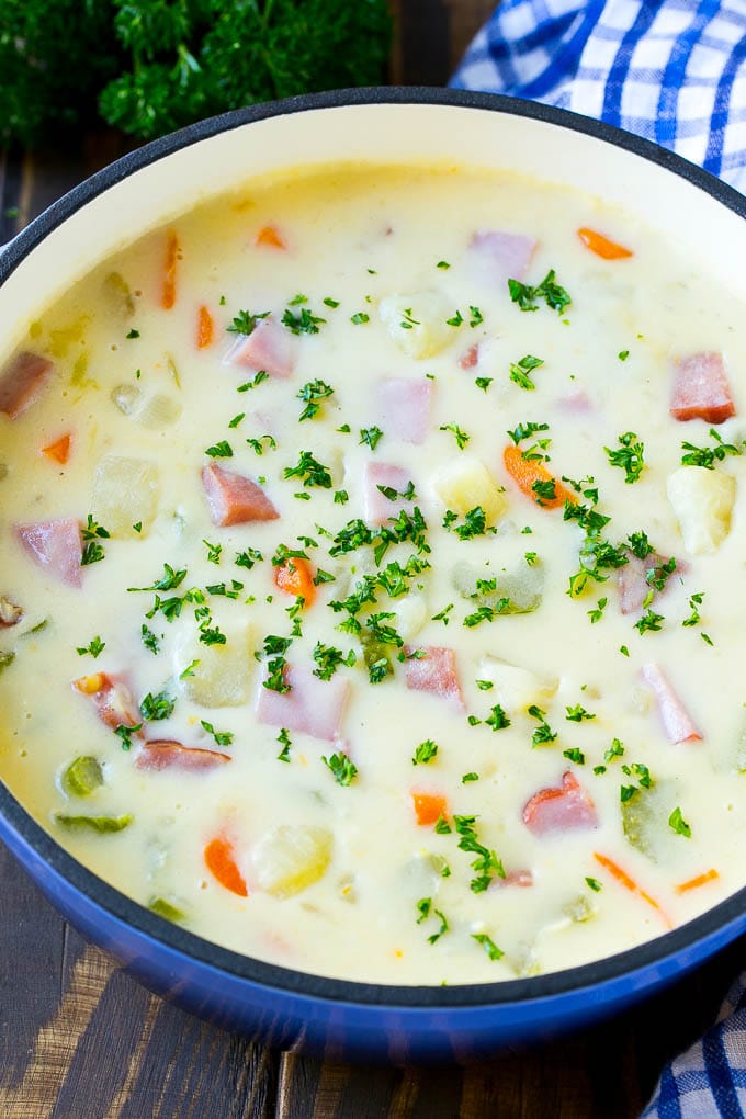 Ham and Potato Soup | Ham Soup | Potato Soup #soup #ham #potato #dinner #comfortfood #sraye A pot of ham and potato soup with vegetables in a creamy broth, topped with parsley.