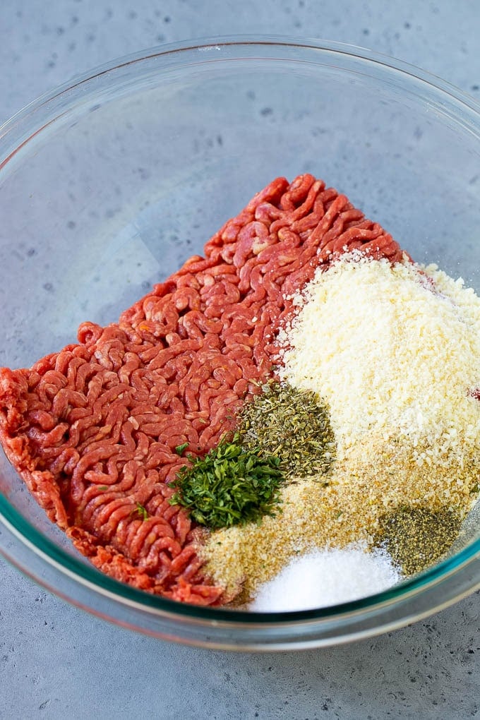 Italian Meatball Soup Recipe | Meatball Soup | Beef Meatballs #meatballs #beef #soup #italian #dinner #sraye #comfortfood Ground beef, breadcrumbs, parsley, herbs and parmesan cheese in a mixing bowl.