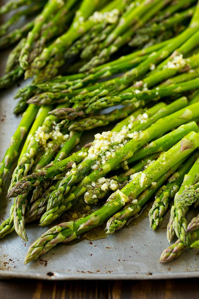 Roasted Asparagus Recipe | Baked Asparagus | Asparagus Side Dish #asparagus #garlic #sidedish #keto #lowcarb #dinner #sraye Raw spears drizzled with olive oil, garlic, herbs, salt and pepper.