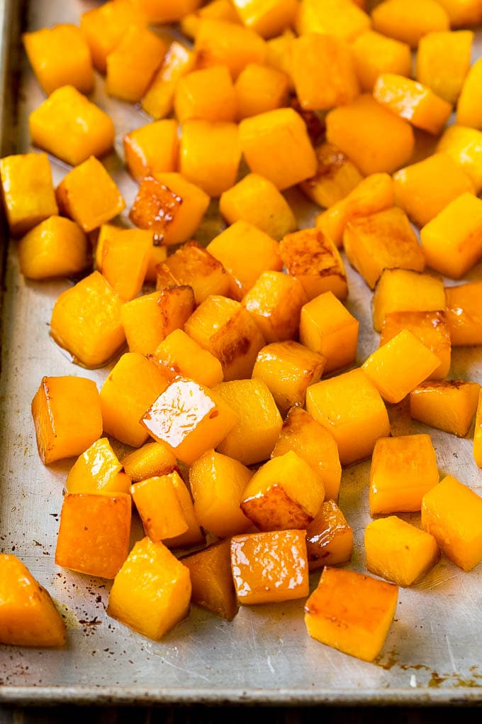 Roasted Butternut Squash Recipe | Baked Butternut Squash | Butternut Squash Side Dish #butternutsquash #squash #fall #vegetarian #dinner #sraye Caramelized cooked butternut squash on a sheet pan.