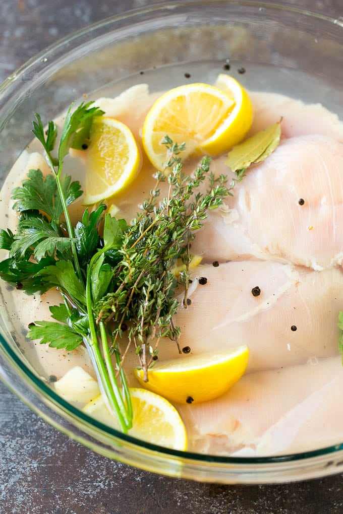 Smoked Chicken Breast Recipe | BBQ Chicken | Smoked Chicken #bbq #chicken #smoker #dinner #glutenfree #sraye Chicken breasts in a bowl of brine with lemon and herbs.