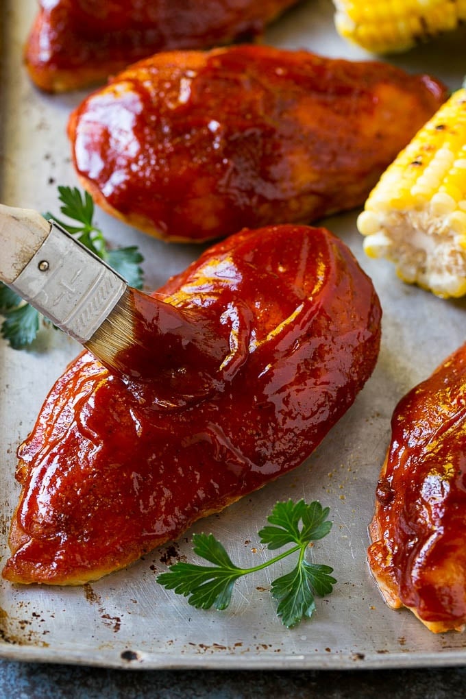 Smoked Chicken Breast Recipe | BBQ Chicken | Smoked Chicken #bbq #chicken #smoker #dinner #glutenfree #sraye Smoked chicken breasts being brushed with BBQ sauce.