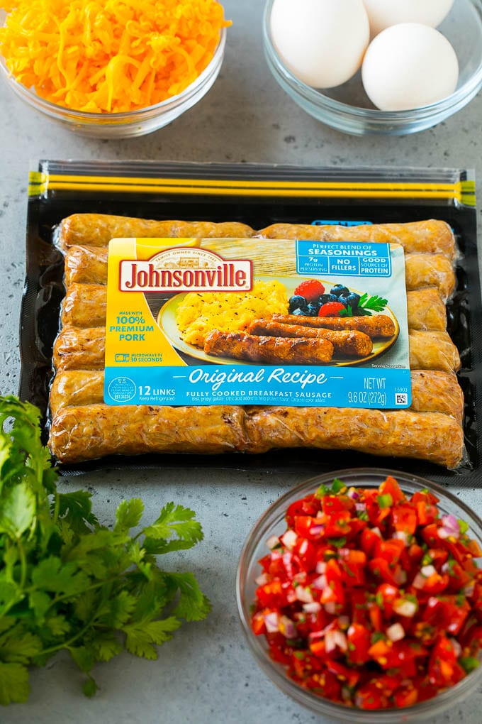Breakfast Burrito Recipe | Sausage Breakfast Burrito #breakfast #sausage #eggs #burrito #sraye A package of sausage links along with bowls of pico de gallo, eggs and shredded cheese.