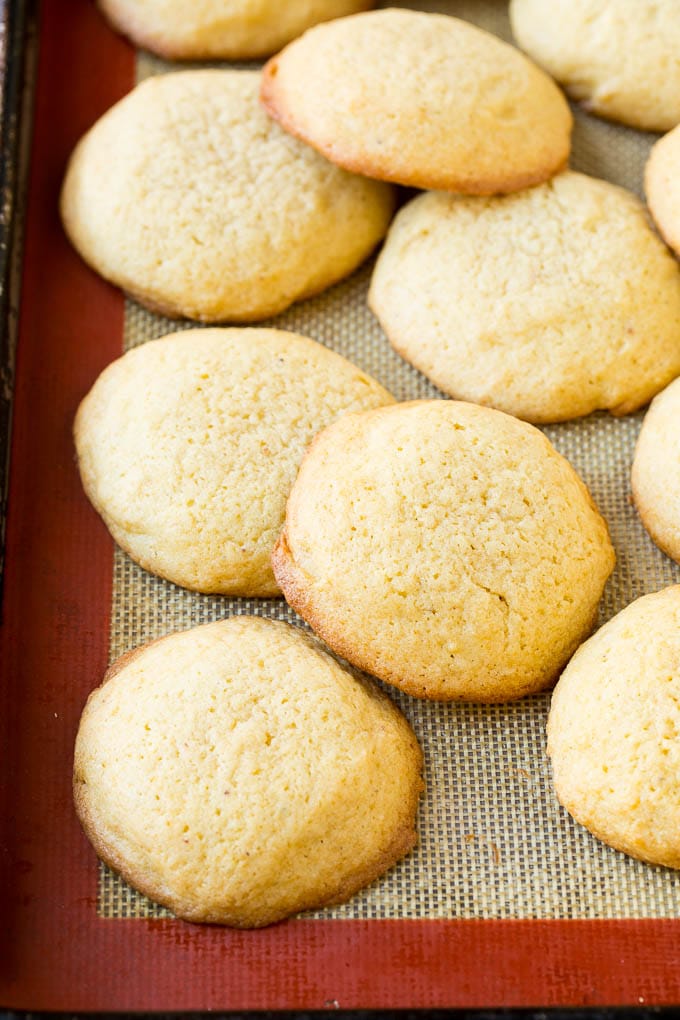 Eggnog Cookies Recipe | Holiday Cookies | Christmas Cookies #cookies #eggnog #baking #christmas #sprinkles #dessert #sraye Baked eggnog cookies on a sheet pan.