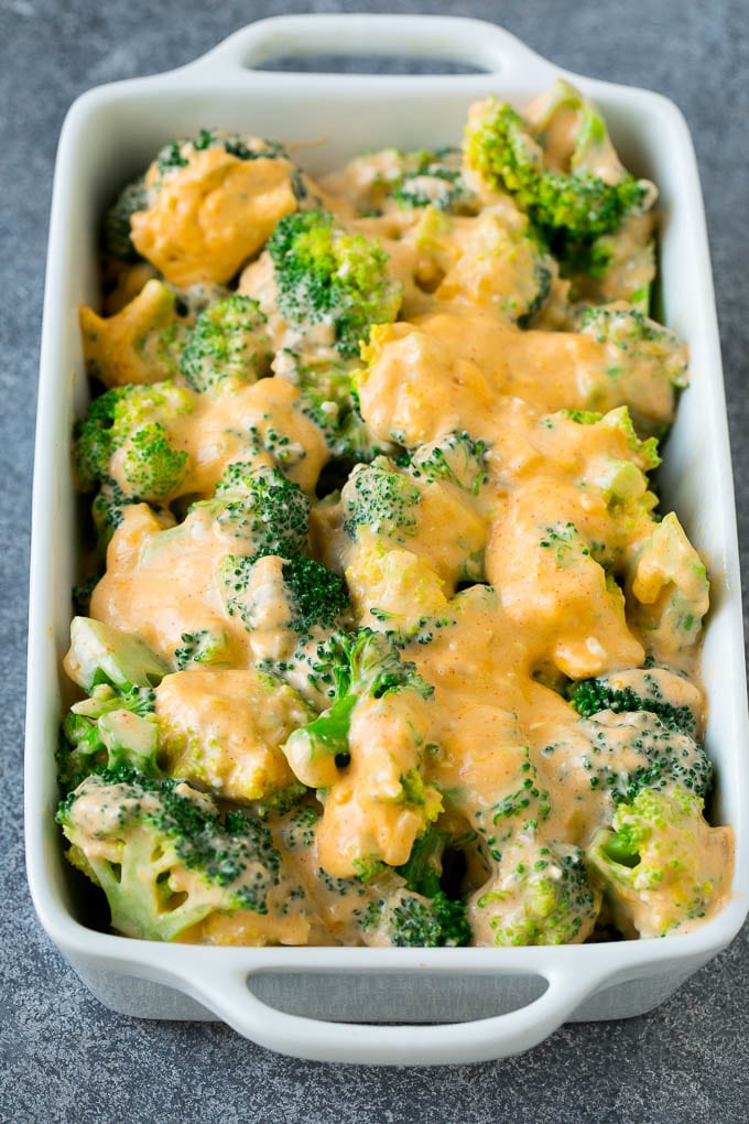 Broccoli Casserole Recipe | Broccoli and Cheese Casserole | Baked Broccoli #broccoli #cheese #casserole #sidedish #dinner #sraye Florets in a baking dish coated with cheese sauce.