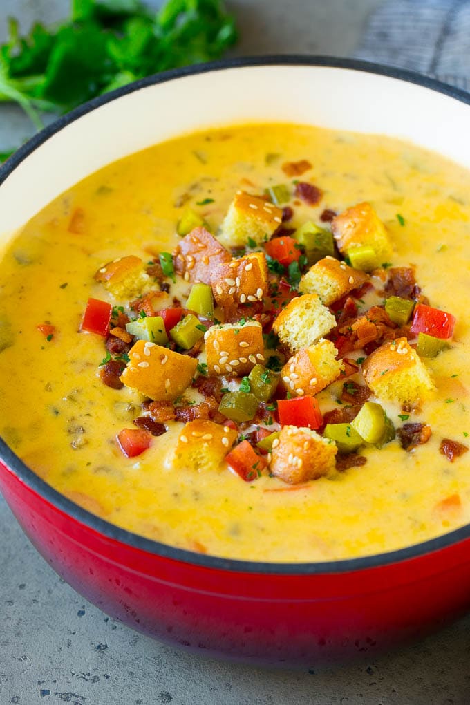 Cheeseburger Soup Recipe | Hamburger Soup | Cheese Soup #soup #groundbeef #hamburger #cheese #bacon #dinner #sraye Cheeseburger soup topped with bacon, tomato, pickles and croutons.