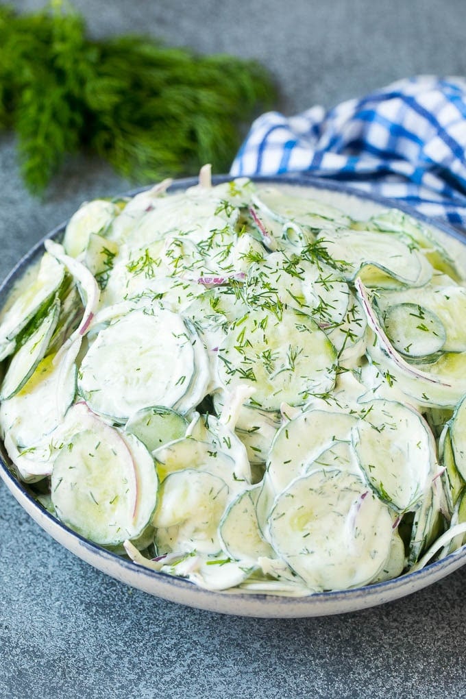 Creamy Cucumber Salad Recipe | German Cucumber Salad | Cucumber Salad #cucumber #salad #dinner #lunch #sraye #cucumbersalad A serving bowl of creamy cucumber salad topped with fresh dill.