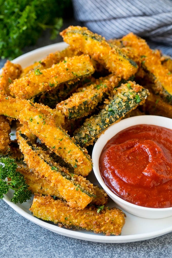 Fried Zucchini Recipe | Zucchini Fries | Zucchini Recipe #appetizer #zucchini #snack #sraye A plate of fried zucchini served with marinara for dipping.