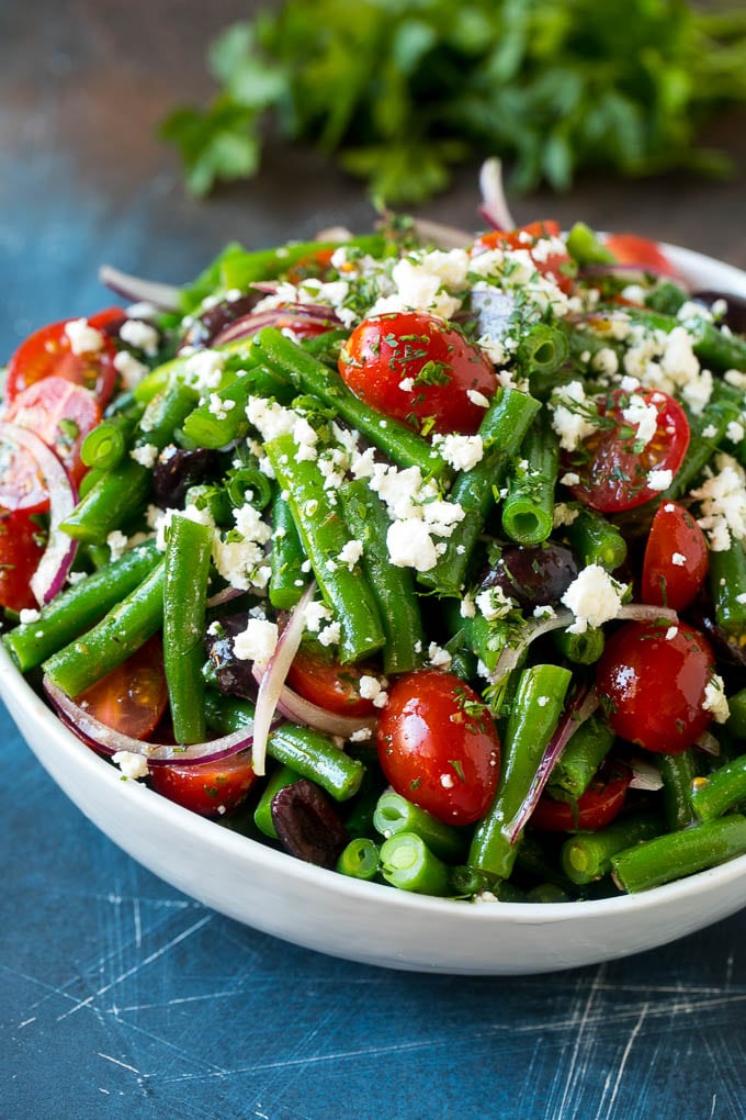 Green Bean Salad Recipe | String Bean Salad | Chopped Salad #greenbeans #tomatoes #olives #salad #cleaneating #lowcarb #glutenfree #sraye Green bean salad tossed in a vinaigrette and topped with feta cheese and herbs.