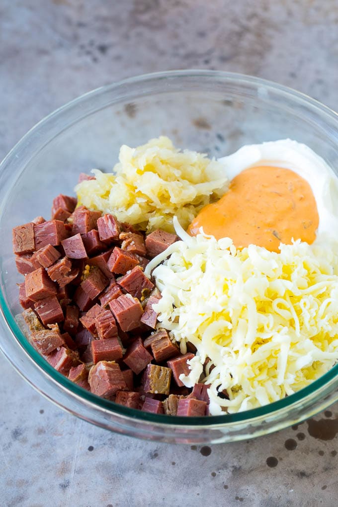 Reuben Dip Recipe | Corned Beef Dip | Cheese Dip #dip #cheese #cornedbeef #appetizer #lowcarb #keto #sraye Corned beef, cream cheese, Thousand Island dressing and cheese in a bowl.