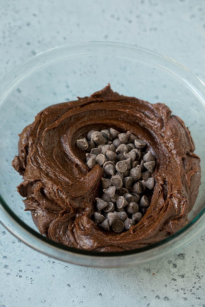 Cheesecake Brownies Recipe | Cream Cheese Brownies | Homemade Brownies #brownies #cheesecake #chocolate #dessert #sraye Brownie batter and chocolate chips in a mixing bowl.