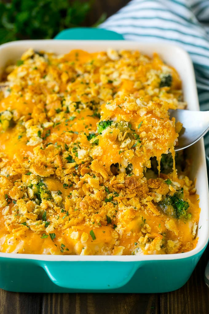 Chicken Casserole Recipe | Chicken and Rice Casserole | Chicken and Broccoli Casserole #casserole #chicken #rice #broccoli #cheese #dinner #sraye A spoon serving up a portion of chicken casserole made with rice and broccoli.