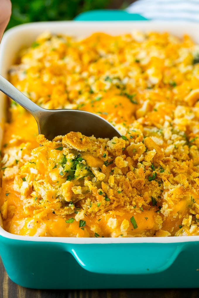 Chicken Casserole Recipe | Chicken and Rice Casserole | Chicken and Broccoli Casserole #casserole #chicken #rice #broccoli #cheese #dinner #sraye A spoon in a dish of chicken and rice casserole.