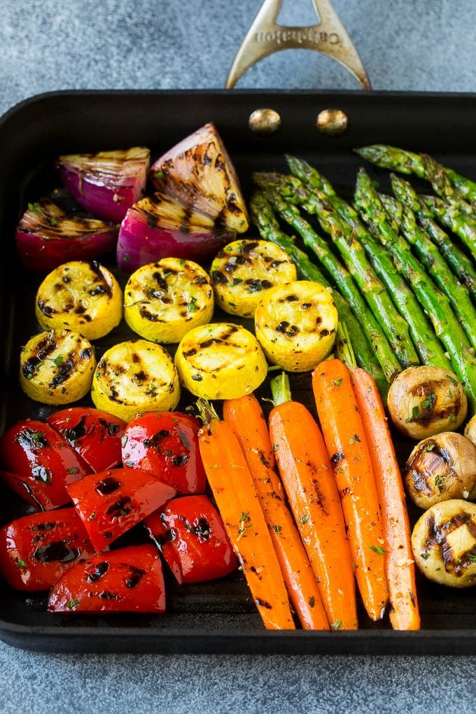 Grilled Vegetables Recipe | Marinated Vegetables | Grilled Veggies #vegetables #veggies #grilling #glutenfree #lowcarb #keto #dinner #sraye #cleaneating #healthy A grill pan with an assortment of vegetables cooking on it.