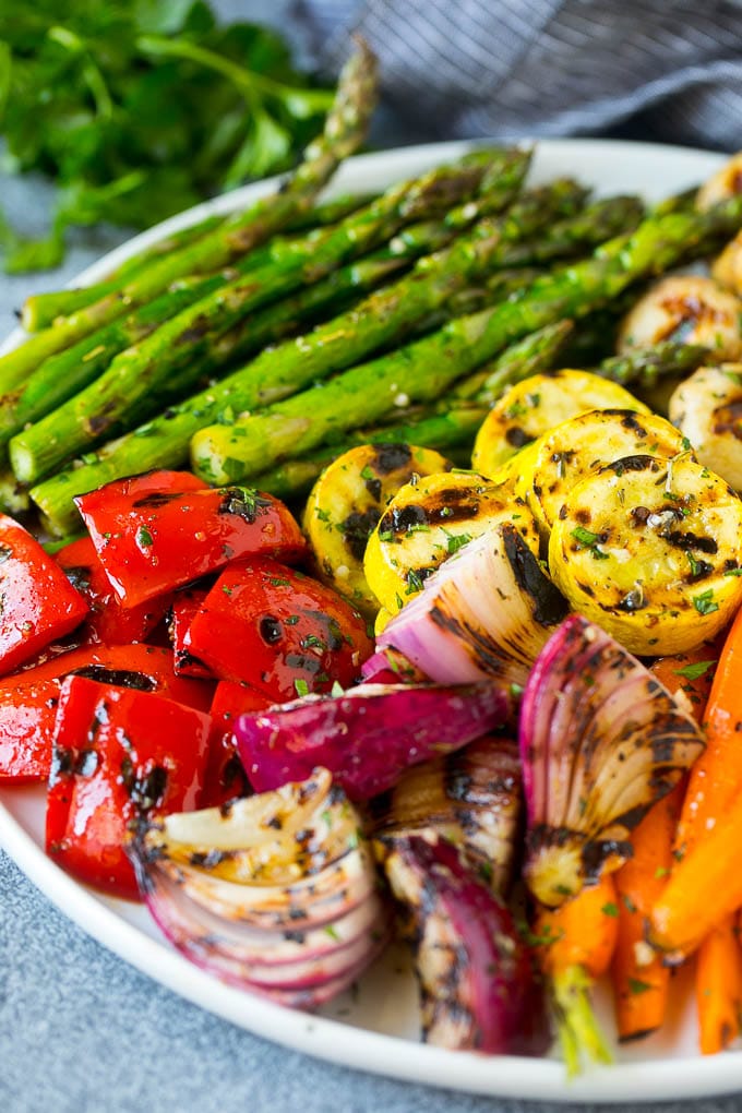 Grilled Vegetables Recipe | Marinated Vegetables | Grilled Veggies #vegetables #veggies #grilling #glutenfree #lowcarb #keto #dinner #sraye #cleaneating #healthy A platter of grilled veggies including peppers, onions and carrots.
