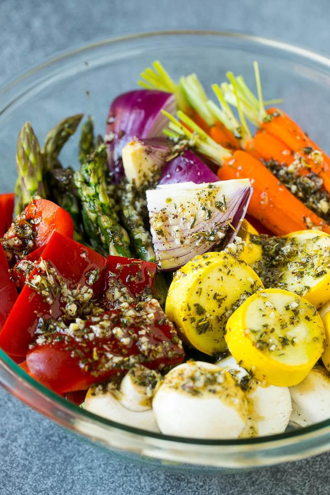Grilled Vegetables Recipe | Marinated Vegetables | Grilled Veggies #vegetables #veggies #grilling #glutenfree #lowcarb #keto #dinner #sraye #cleaneating #healthy Raw veggies in a bowl with garlic, herbs and olive oil.