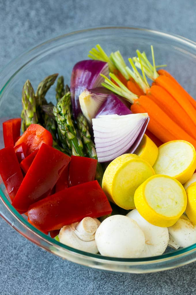 Grilled Vegetables Recipe | Marinated Vegetables | Grilled Veggies #vegetables #veggies #grilling #glutenfree #lowcarb #keto #dinner #sraye #cleaneating #healthy Carrots, peppers, squash, mushrooms and asparagus in a mixing bowl.