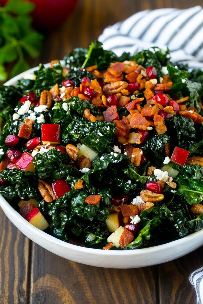 Apple Kale Salad Recipe | Kale Recipe | Fall Salad #kale #apples #bacon #salad #feta #dinner #lunch #sraye Apple kale salad topped with bacon and pecans.