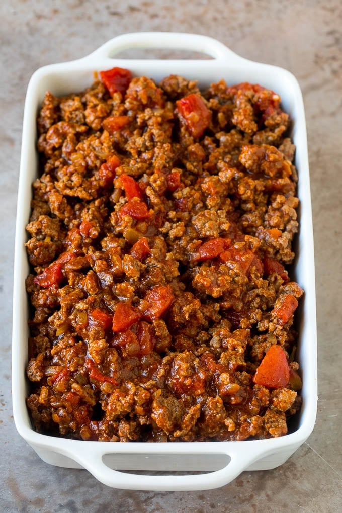 Taco Casserole Recipe | Mexican Casserole | Beef Casserole #casserole #tacos #beef #dinner #cheese #sraye Cooked taco meat in a casserole dish.