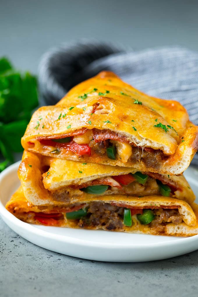 Calzone Recipe | Pizza Pockets #pizza #calzone #pepperoni #sausage #peppers #dinner #sraye #cheese Calzone halves stuffed with sausage, peppers, cheese and pepperoni.