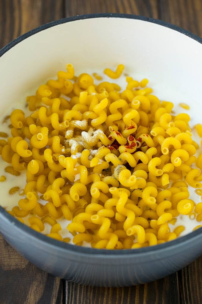 Lobster Mac and Cheese Recipe | Lobster Macaroni and Cheese | Baked Mac and Cheese #pasta #macandcheese #macaroni #lobster #cheese #dinner #sraye Pasta with milk and spices in a pot.