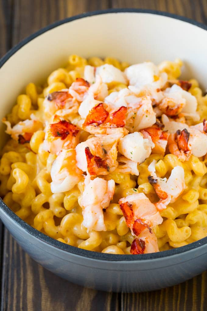 Lobster Mac and Cheese Recipe | Lobster Macaroni and Cheese | Baked Mac and Cheese #pasta #macandcheese #macaroni #lobster #cheese #dinner #sraye Stove top mac and cheese topped with pieces of cooked lobster.