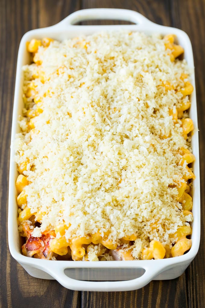Lobster Mac and Cheese Recipe | Lobster Macaroni and Cheese | Baked Mac and Cheese #pasta #macandcheese #macaroni #lobster #cheese #dinner #sraye A casserole dish of lobster mac and cheese topped with panko breadcrumbs.