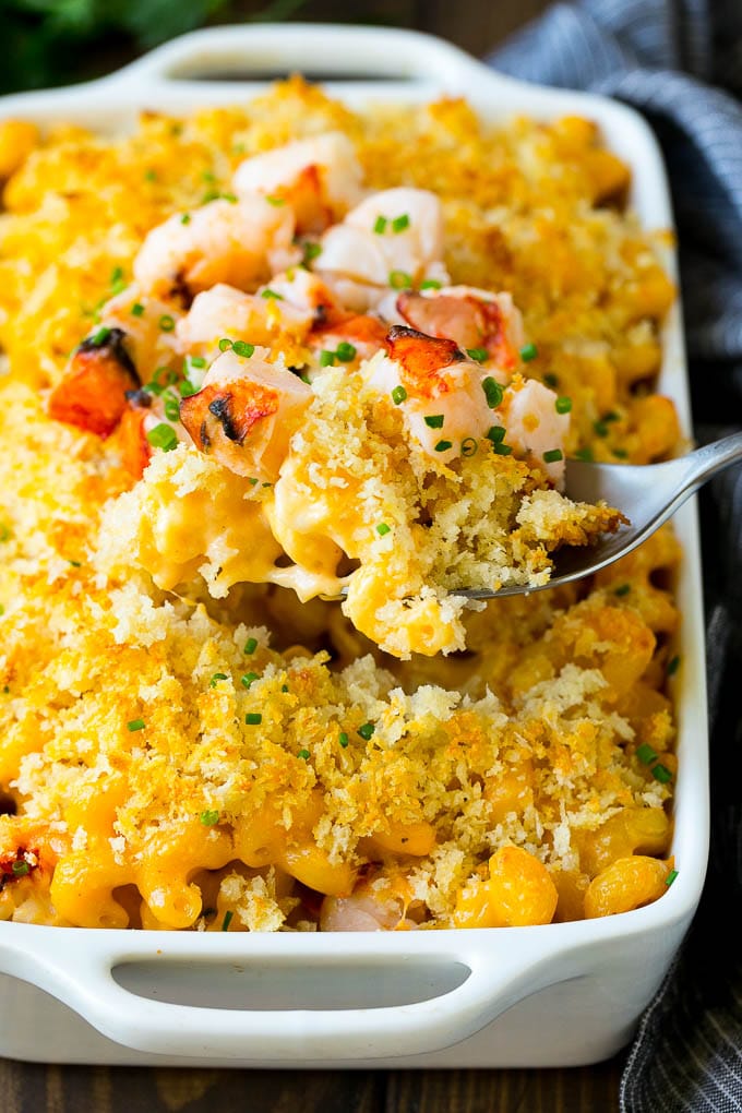 Lobster Mac and Cheese Recipe | Lobster Macaroni and Cheese | Baked Mac and Cheese #pasta #macandcheese #macaroni #lobster #cheese #dinner #sraye A spoon serving up a portion of lobster mac and cheese.