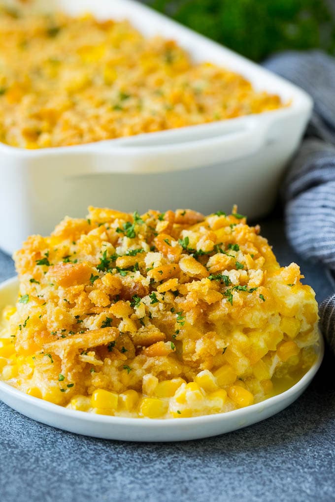 Scalloped Corn | Corn Casserole #corn #casserole #cheese #sidedish #dinner #sraye A serving of scalloped corn topped with buttery cracker crumbs.