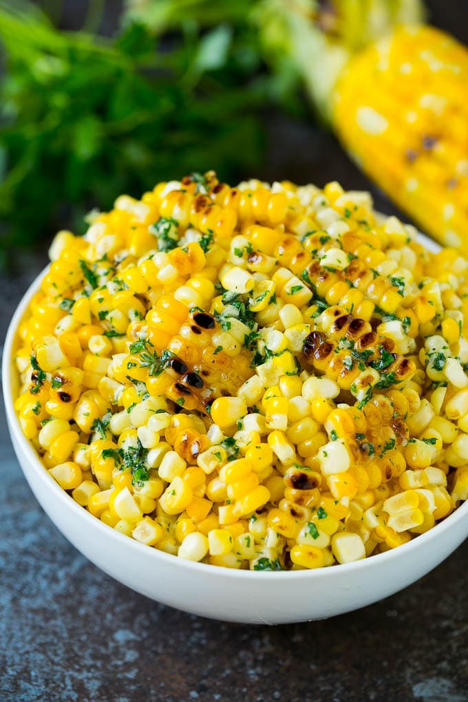 Grilled Corn on the Cob Recipe | Corn Recipe #corn #grilling #summer #sidedish #dinner #sraye Grilled corn cut off the cob with herb butter in a bowl.