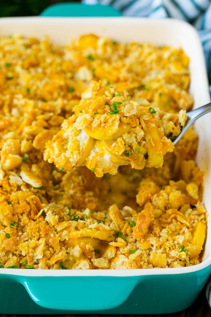 Squash Casserole Recipe | Vegetable Casserole | Zucchini Casserole #casserole #squash #zucchini #cheese #sidedish #sraye A spoon serving up a portion of cheesy squash casserole.