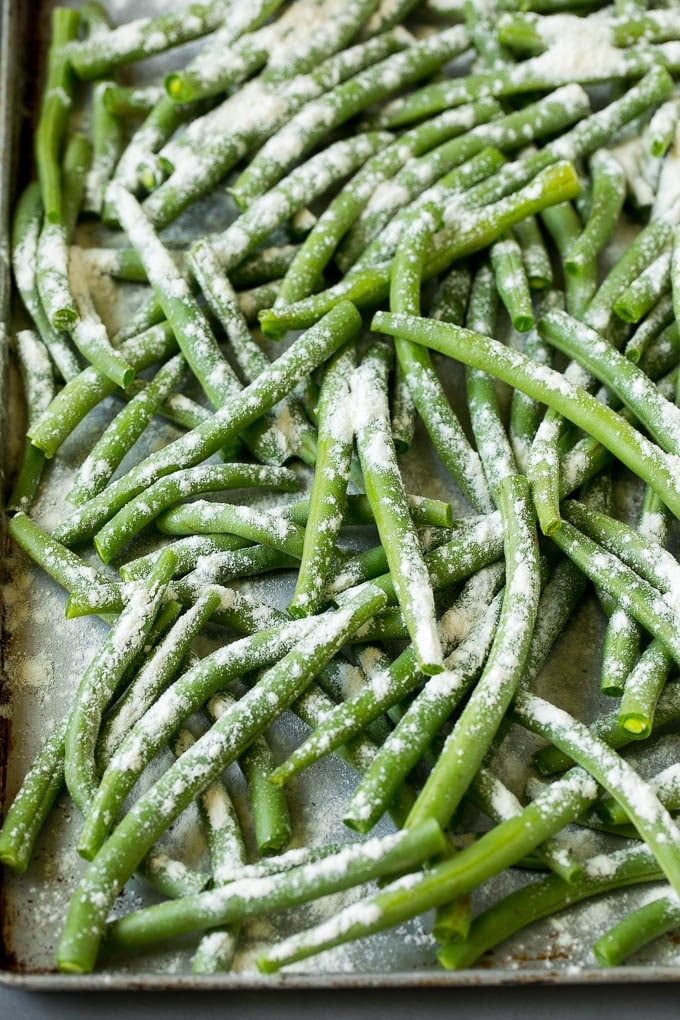 Fried Green Beans Recipe | Green Beans #greenbeans #appetizer #snack #sraye Bean coated in flour on a pan.