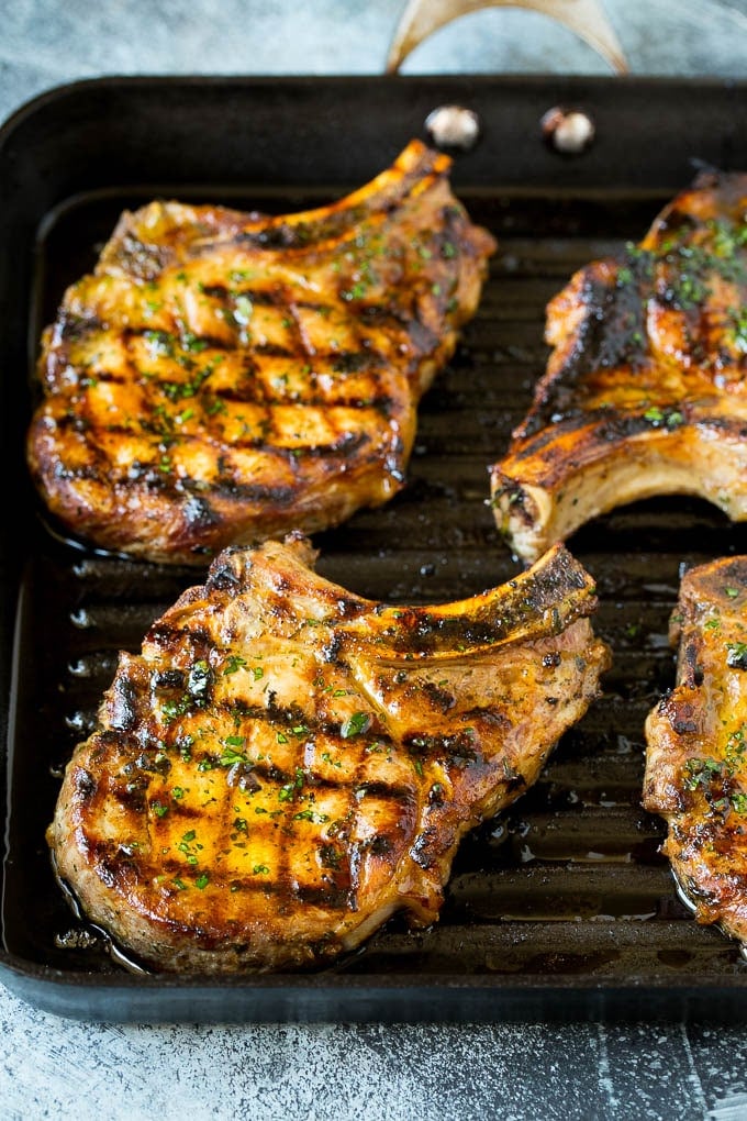 Grilled Pork Chops | Pork Chop Marinade #porkchops #grilling #pork #marinade #dinner #sraye Pork chops on a grill pan.
