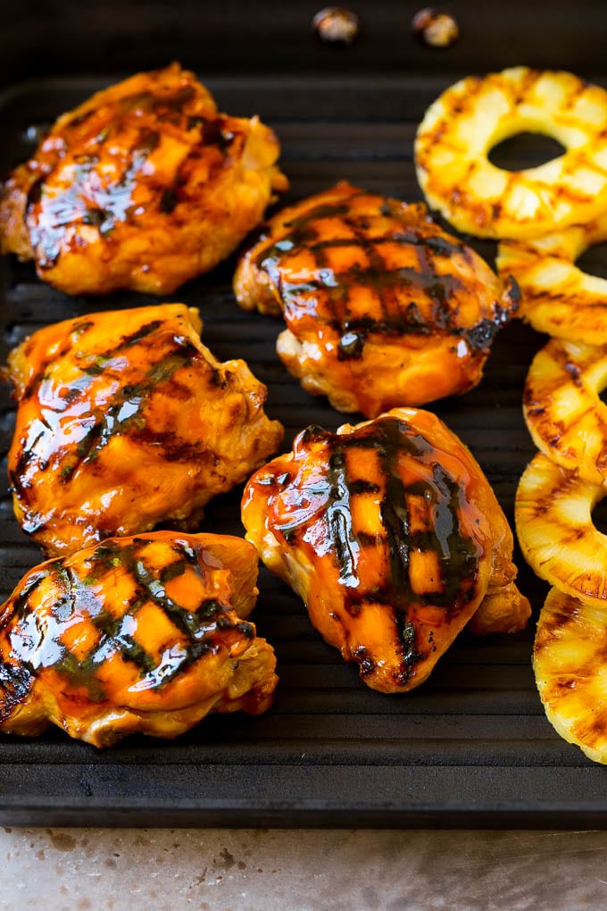 Huli Huli Chicken Recipe | Hawaiian Chicken | Grilled Chicken Thighs #chicken #pineapple #grilling #dinner #sraye Poultry and pineapple slices on a grill pan.