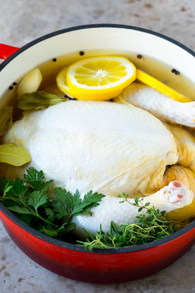Rotisserie Chicken Recipe | Roasted Chicken #chicken #dinner #sraye #comfortfood A whole chicken in a pot of brine.