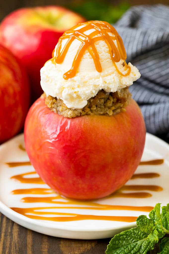 Baked Apples | Stuffed Apples #apples #fall #dessert #sweettooth #sraye A baked apple topped with vanilla ice cream and caramel sauce.