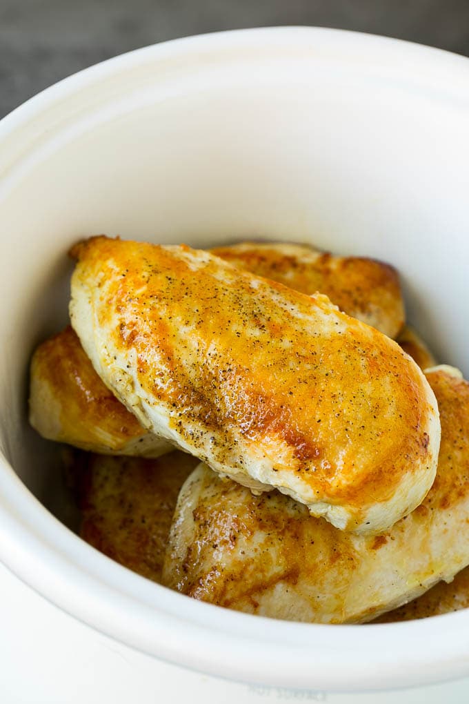 Slow Cooker Chicken Breast Recipe | Crock Pot Chicken Breast | Chicken and Gravy #chicken #slowcooker #crockpot #gravy #dinner #sraye Seared chicken breasts in a crock pot.