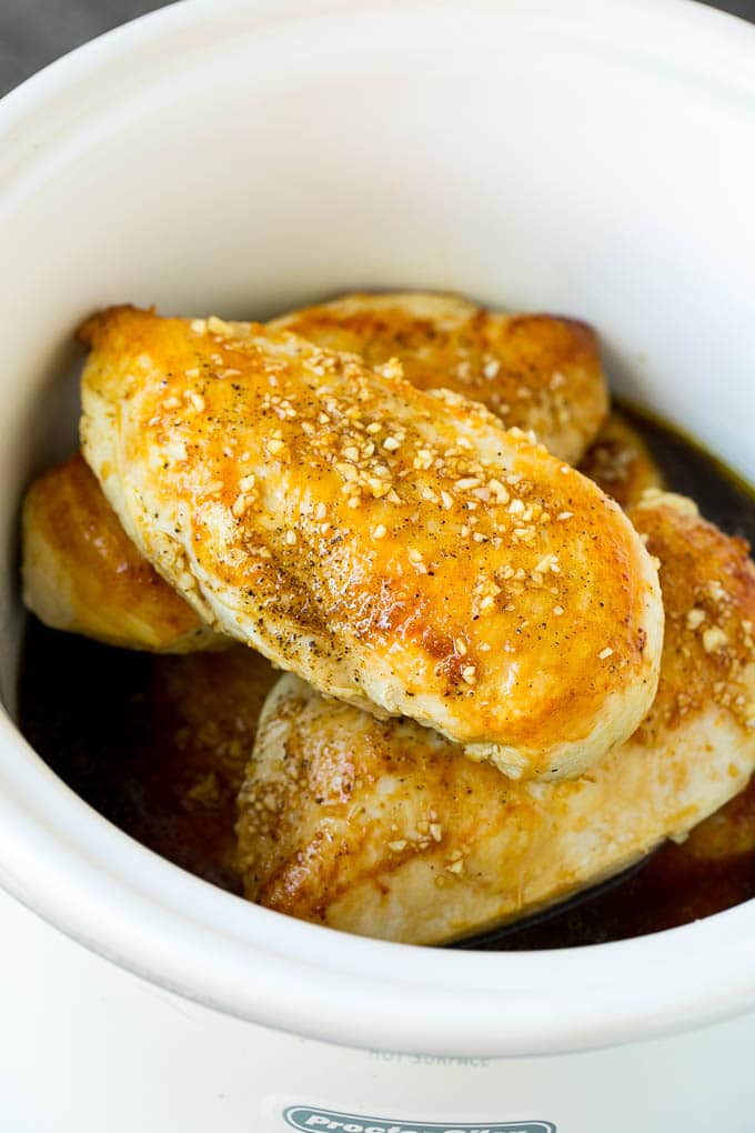 Slow Cooker Chicken Breast Recipe | Crock Pot Chicken Breast | Chicken and Gravy #chicken #slowcooker #crockpot #gravy #dinner #sraye Chicken breasts with garlic and herb sauce poured over the top.