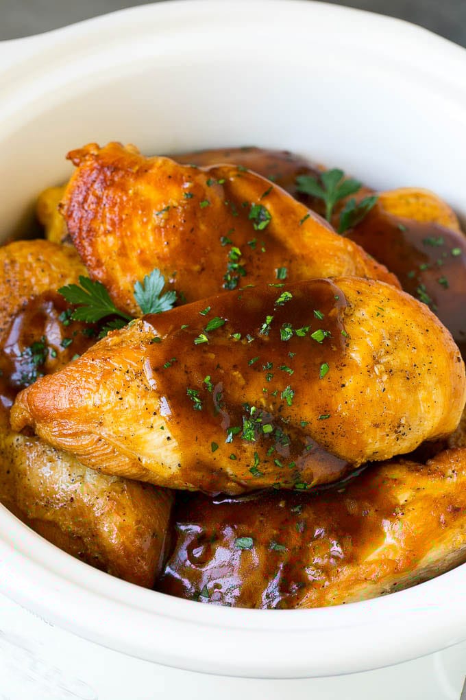 Slow Cooker Chicken Breast Recipe | Crock Pot Chicken Breast | Chicken and Gravy #chicken #slowcooker #crockpot #gravy #dinner #sraye Slow cooker chicken breast topped with gravy and parsley.