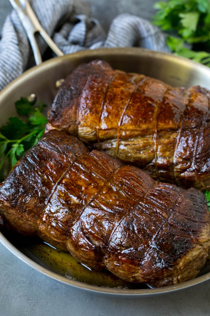Beef Tenderloin with Garlic Butter #beef #steak #dinner #sraye Roasted garlic butter beef tenderloin in a pan.
