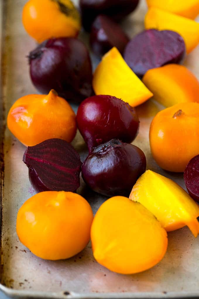 Beet Salad Recipe #beets #avocado #feta #salad #dinner #sraye Roasted red and yellow beets on a sheet pan.