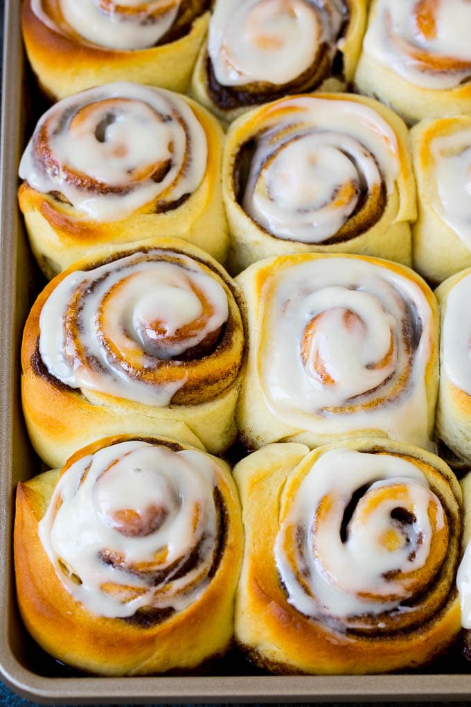 Cinnamon Rolls Recipe | Cinnamon Buns #cinnamon #rolls #pastry #breakfast #brunch #sweets #sraye #baking #bread A tray of frosted cinnamon rolls.