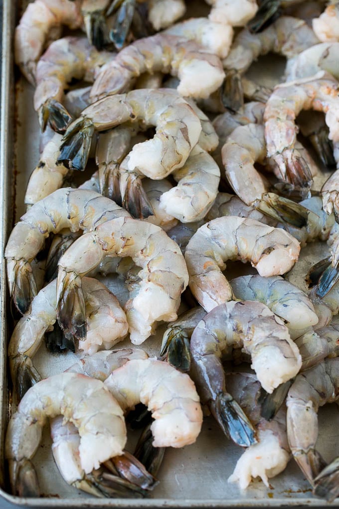 Fried Shrimp Recipe #shrimp #seafood #dinner #appetizer #sraye Raw shrimp on a sheet pan.
