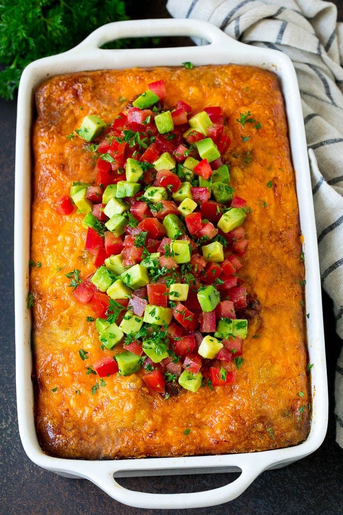 Sausage Egg Casserole Recipe | Egg Casserole #eggs #sausage #potato #cheese #casserole #breakfast #brunch #sraye Sausage egg casserole topped with avocado and tomato.
